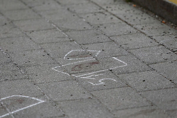 Footprints are encircled at the train station after an attack in Grafing