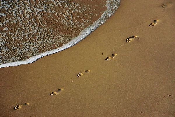 Footprints are left on the shore of Sydneys Bronte Beach