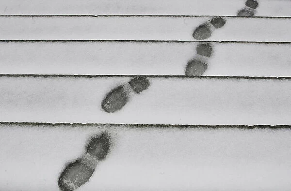 Footprints can be seen on the snow outside Madrids Almudena Cathedral as freezing