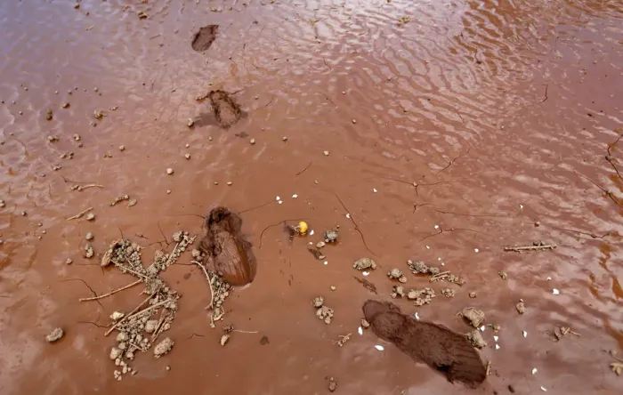 Framed Print : Footprints are seen on wet ground as volunteers arrive for a recovery mission after a dam Framed Print : Footprints are seen on wet ground as volunteers arrive for a recovery mission after a dam
