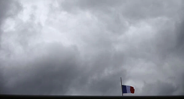 Frances flag flies at half mast on the roof of the French embassy in Berlin