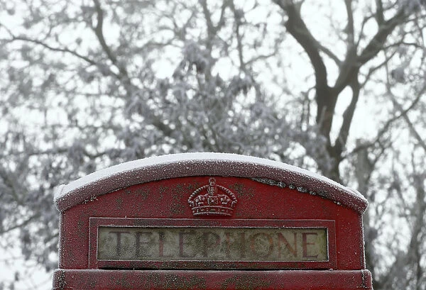 A frost covered telephone box stands in Newhaven, central England