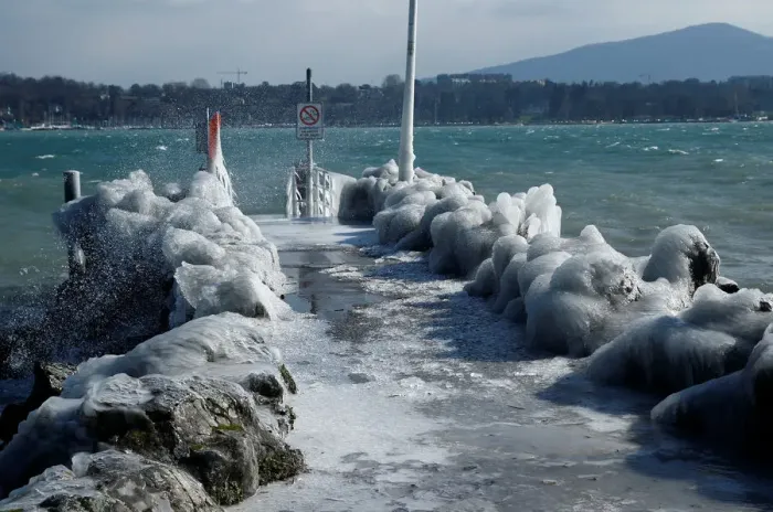 Framed Print : A frozen pier is seen during a windy winter day near Lake Leman in Geneva Framed Print : A frozen pier is seen during a windy winter day near Lake Leman in Geneva