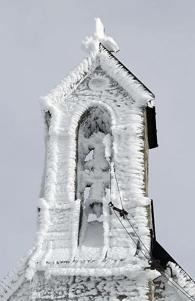 The frozen tower of Wendelstein church is pictured near Bayrischzell