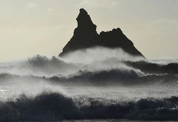 Gale force winds blow back the waves at Church Rock on Broad Haven Beach in Pembrokeshire