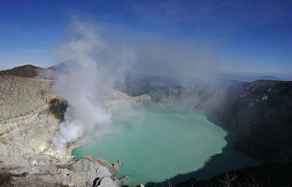 A general view of Kawah Ijen volcanic crater and the sulphur mines located at its foot
