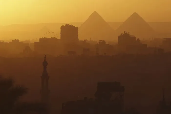Framed Print : A general view of mosques and the great pyramids before sunset in Cairo Framed Print : A general view of mosques and the great pyramids before sunset in Cairo