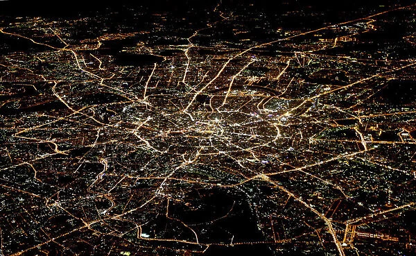 A general view of night Moscow is seen from the window of a passenger jet