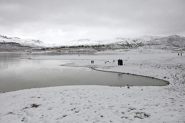 A general view of people visiting the snow-covered Hanna Lake after a snowfall