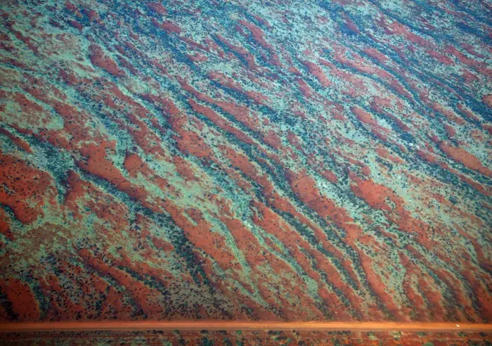 Framed Print : A general view of a road next to sand dunes covered in vegetation in the Pilbara region Framed Print : A general view of a road next to sand dunes covered in vegetation in the Pilbara region