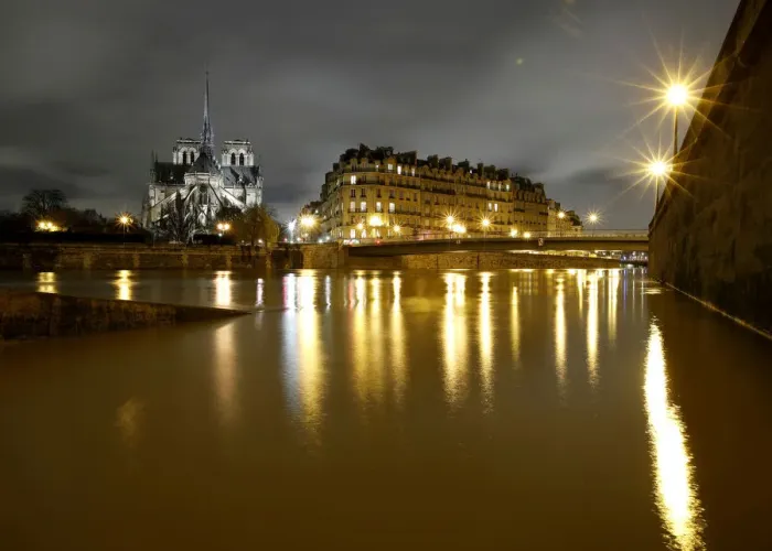 Framed Print : A general view shows the Notre Dame Cathedral at night, on the flooded banks of the River Framed Print : A general view shows the Notre Dame Cathedral at night, on the flooded banks of the River