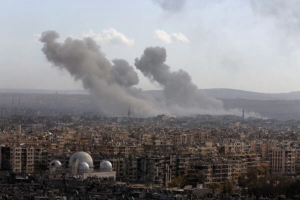 A general view shows rising smoke after strikes on Aleppo city