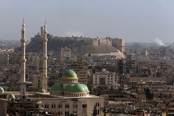 A general view shows rising smoke after strikes near Aleppo citadel in Aleppo city