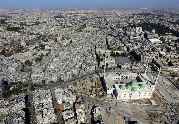 Framed Print : A general view taken with a drone shows a mosque where forces loyal to Syrias President