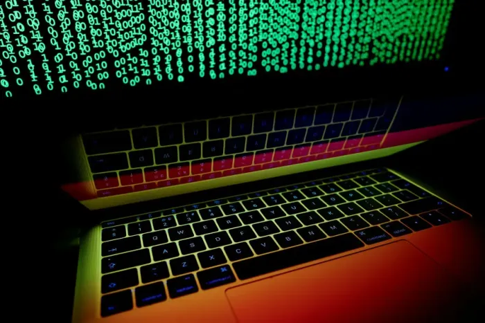 Framed Print : German flag is seen on the laptop screen in front of a computer screen on which cyber Framed Print : German flag is seen on the laptop screen in front of a computer screen on which cyber