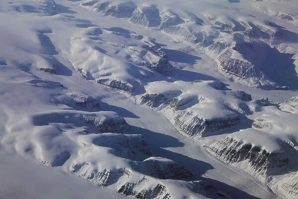 Glaciers are seen making their way through mountains on the eastern coast of Greenland