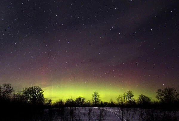 The glow of the Aurora Borealis, or Northern Lights, is seen in the horizon in Kawartha