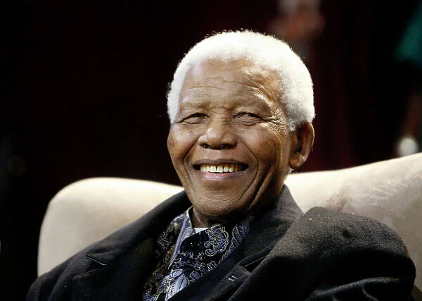 GM1E47C1PSK01. Former President Nelson Mandela smiles as he arrives with