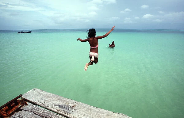 GM1E66H0H5I01. A girl jumps into the sea in The Corn Islands June 16, 2010