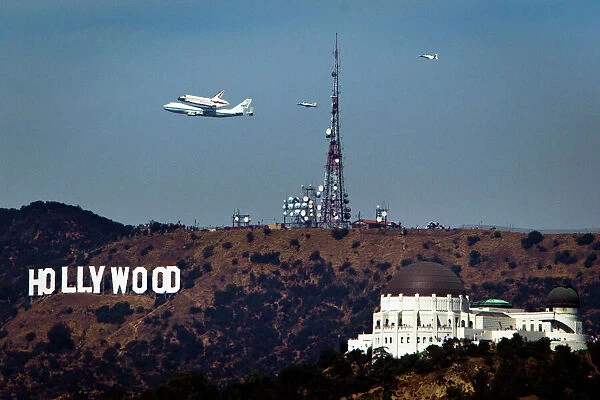 GM1E89M09R001. The Space Shuttle Endeavour flies by the Hollywood sign