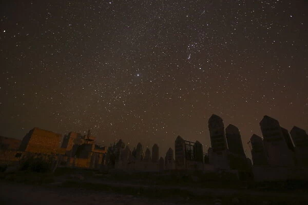 A graveyard is pictured at night in Aleppo, Syria