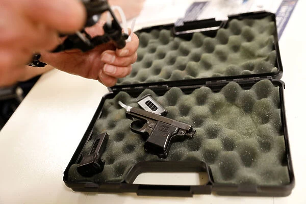 A handgun is checked in during a community gun buy-back program in White Plains, New York