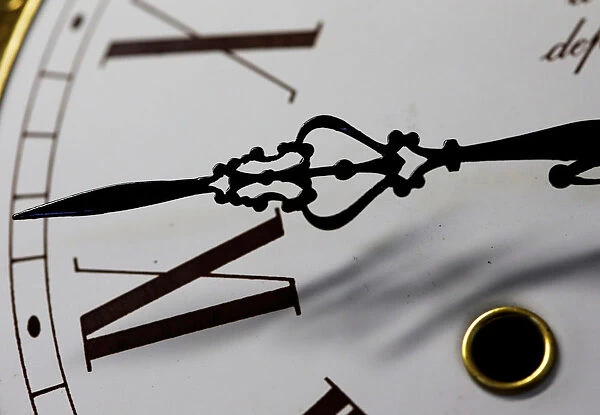The hands of a clock are pictured in a watchmakers shop in Bordeaux