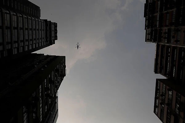 A helicopter flies above an anti-government rally in Wan Chai district, Hong Kong