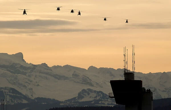Helicopters approach to land before the arrival of U. S. President Trump at Zurich airport