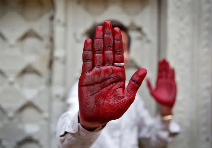 Framed Print : A Hindu devotee displays his inked hand after taking part in the religious festival of Framed Print : A Hindu devotee displays his inked hand after taking part in the religious festival of