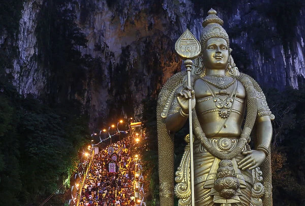 Hindu devotees climb the steps to Batu Caves temple during Thaipusam in Kuala Lumpur