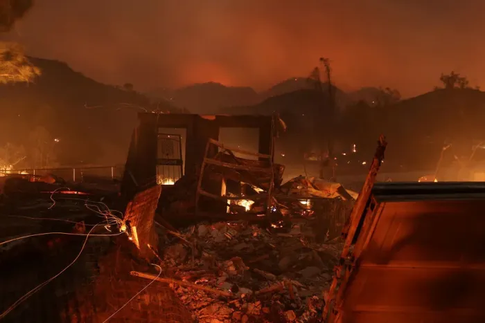 Framed Print : A home burns as strong winds push the Thomas Fire across thousands of acres near Santa