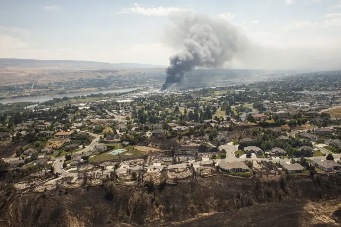 Framed Print : Homes destroyed by the Sleepy Hollow fire are seen as commercial buildings burn in Framed Print : Homes destroyed by the Sleepy Hollow fire are seen as commercial buildings burn in