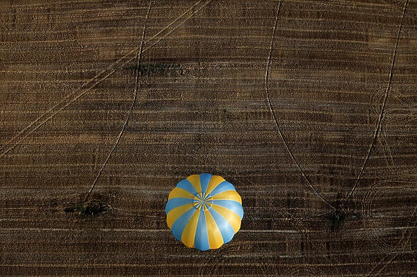 A hot air balloon flies during a hot air ballooning event in Todi