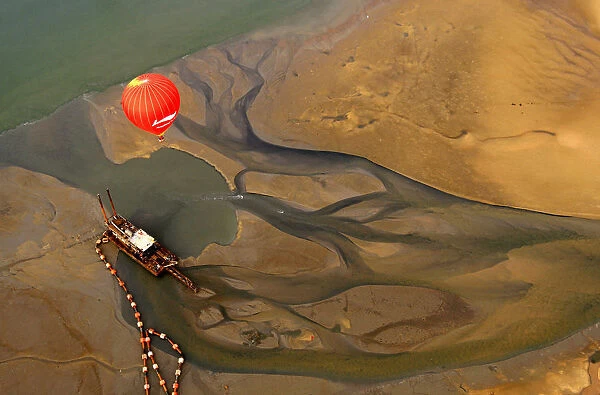 A hot air balloon flies across the Qiongzhou strait during the first Haikou Fire Balloon