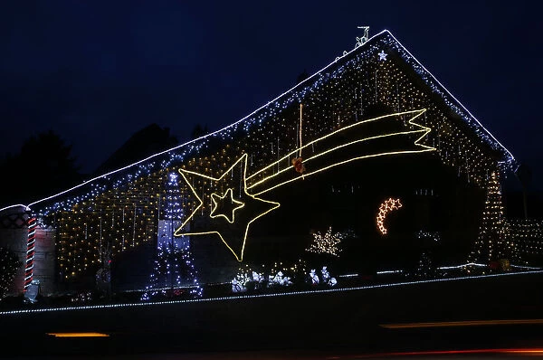 A house is decorated with a huge Star of Bethlehem in the village of Brueggen near