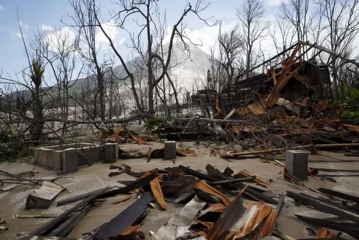 Framed Print : A house destroyed by the eruption of Mount Sinabung is seen in an abandoned plantation in