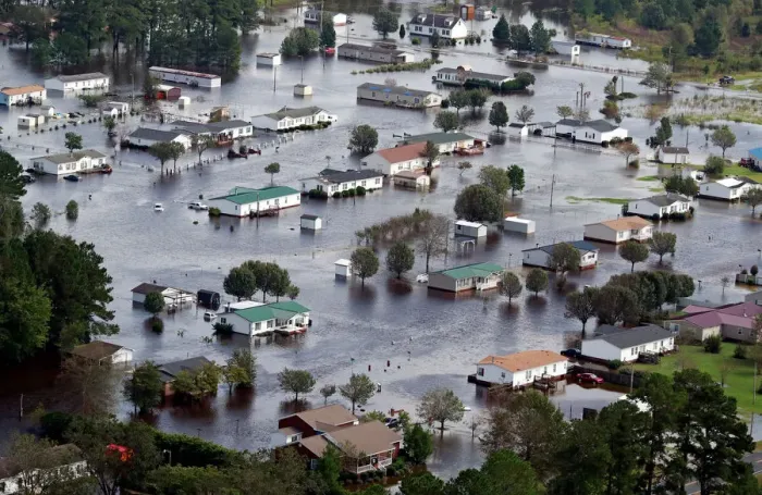 Framed Print : Houses sit in floodwater caused by Hurricane Florence, in this aerial picture