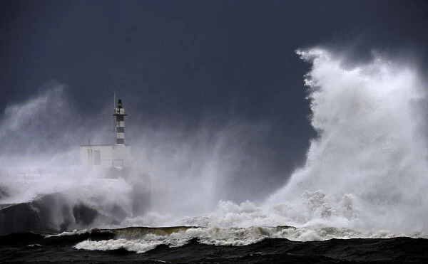 Huge waves crash on the San Esteban de Pravia seafront in Asturias region