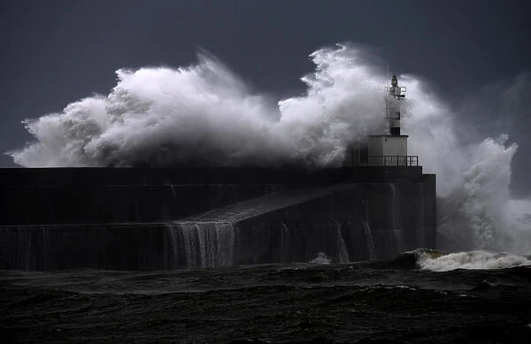 Huge waves crash on the San Esteban de Pravia seafront in Asturias region