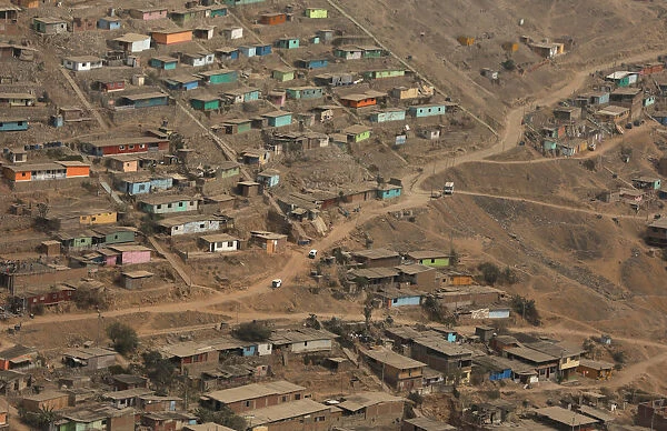 Huts and houses are seen on the hills of Nueva Esperanza ( New Hope