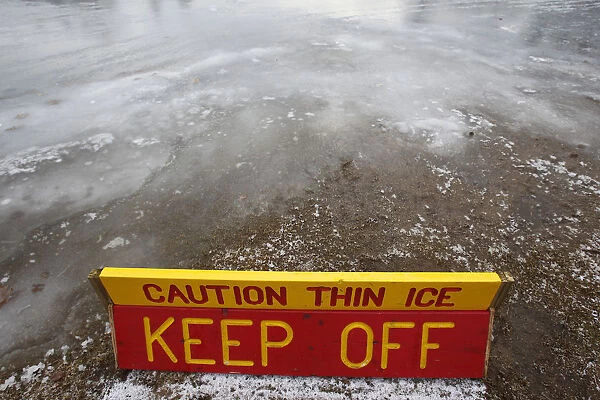 A thin ice warning is posted at Whites Pond in Concord, New Hampshire