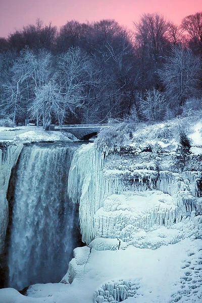 Ice and water flow over the American Falls, viewed from the Canadian side in Niagara