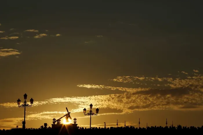 Framed Print : The image of the Nazarene of La O brotherhood is silhouetted by the sun during a Holy