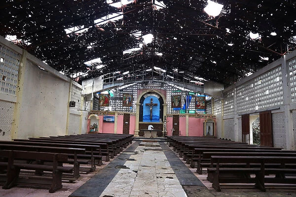 The interior of a bullet-riddled Catholic church is seen in Marawi