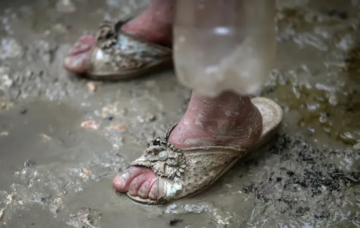 Framed Print : An internally displaced Syrian girl stands in the mud after heavy rain at a camp on Framed Print : An internally displaced Syrian girl stands in the mud after heavy rain at a camp on