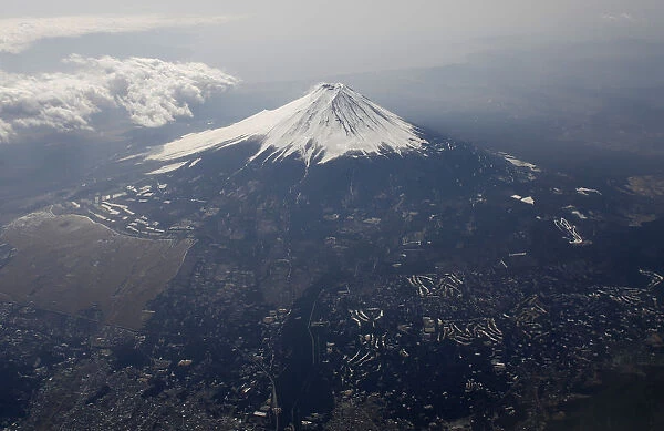 Japans Mount Fuji is seen covered with snow from an airplane