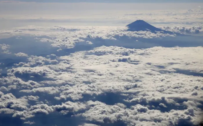 Framed Print : Japans Mount Fuji, surrounded by cloud, is seen from an airplane Framed Print : Japans Mount Fuji, surrounded by cloud, is seen from an airplane