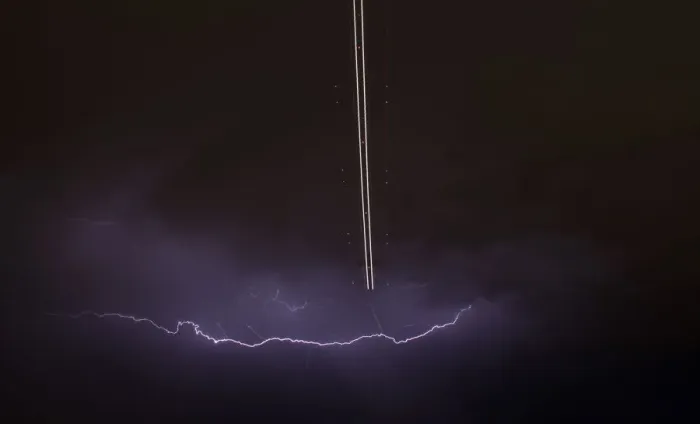Framed Print : Jet aircraft takes off as lightning strikes across the sky during a monsoon storm Framed Print : Jet aircraft takes off as lightning strikes across the sky during a monsoon storm