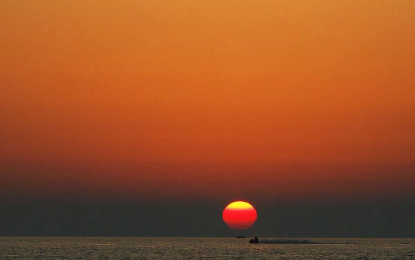 Jet ski rider enjoys the sunset at the Albanian beach of Durres